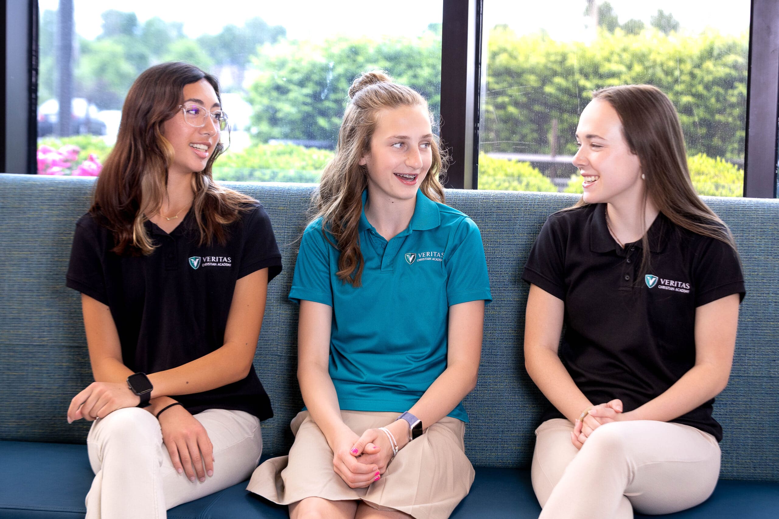 VCA students sitting on a couch.
